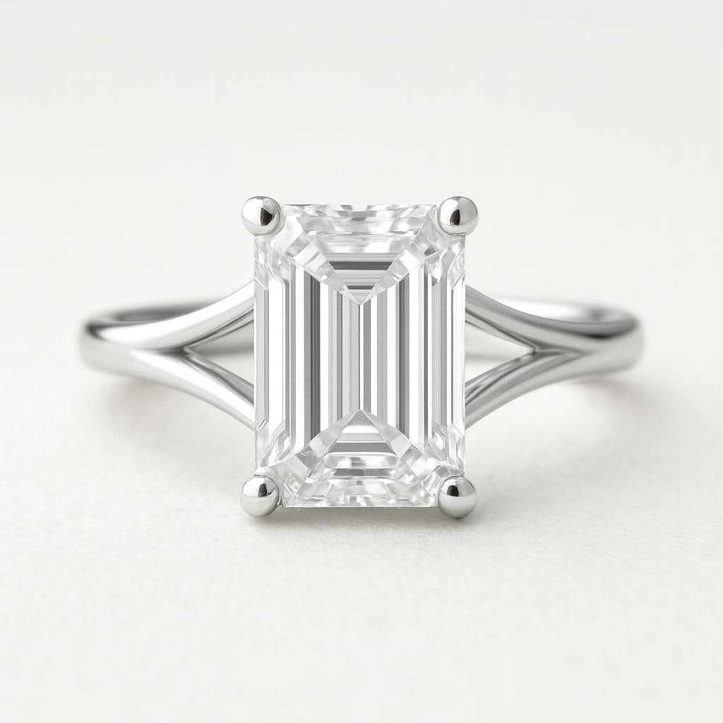 5 CT Lab Grown Emerald Cut Diamond Solitaire Ring with Split Shank in 14K White Gold: Elegant 5 carat lab grown emerald cut diamond solitaire, mounted in a secure four-prong setting. The split shank design in 14K white gold adds a modern touch while enhancing the brilliance of the cent