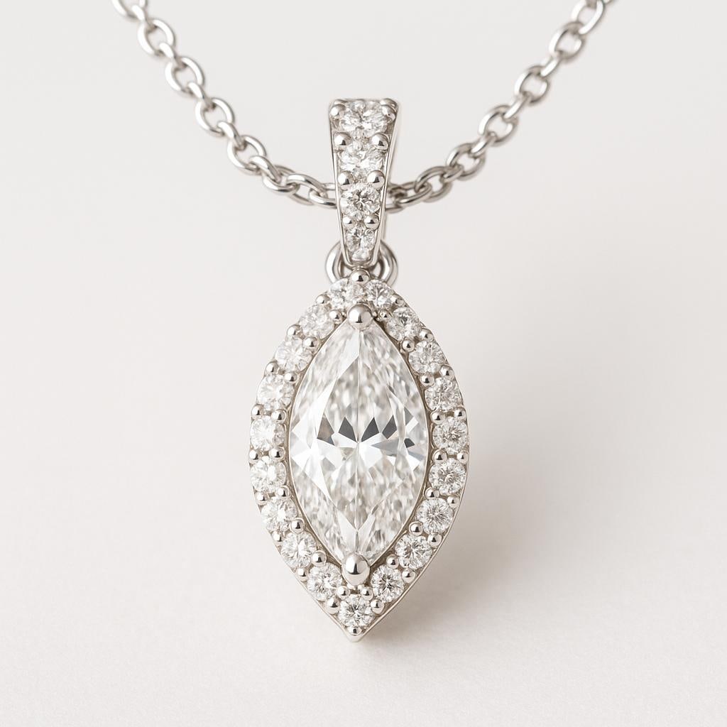 2 CT Lab Grown Marquise Cut Diamond Halo Pendant in 14K White Gold: Elegant 2 carat lab grown marquise cut diamond centerpiece, encircled by a halo of sparkling lab grown round diamonds. Suspended from a pavé-accented bail on a refined chain, this 14K white gold pend