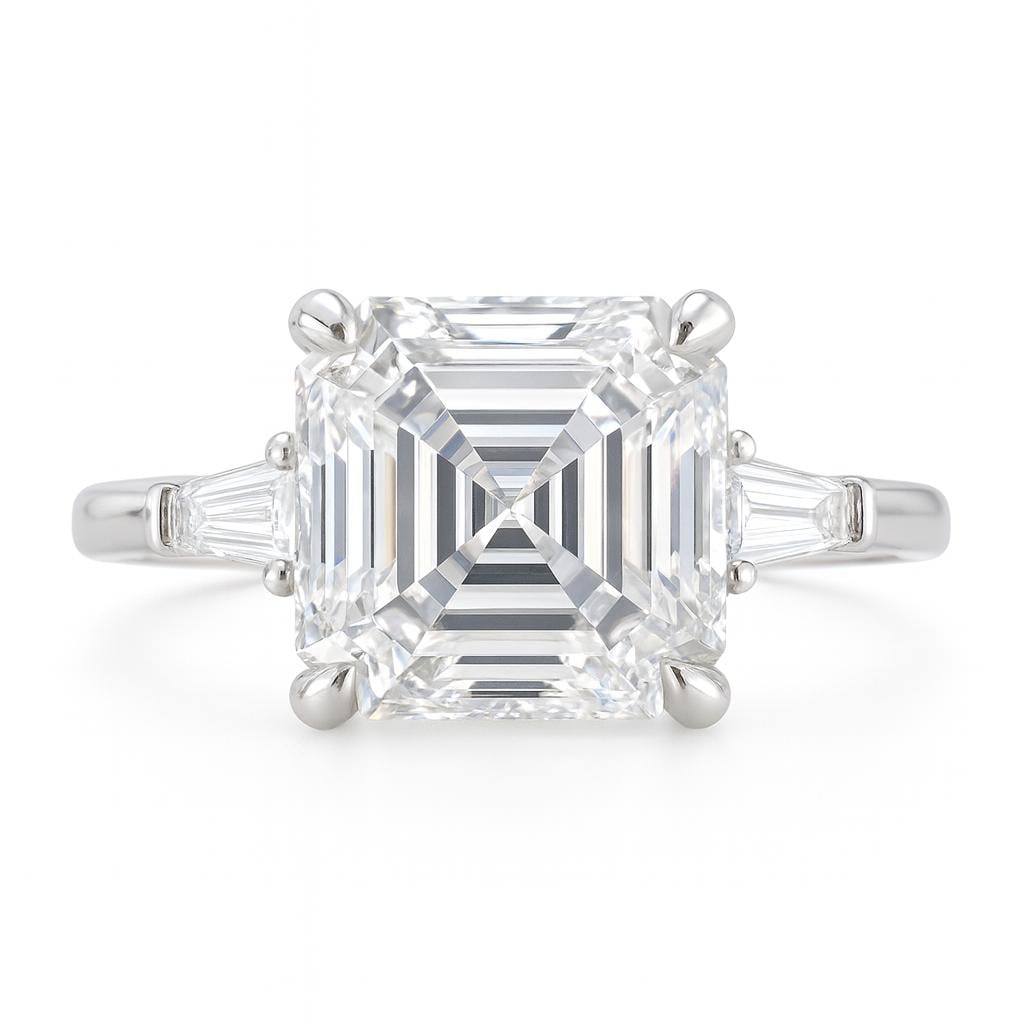 6.50 CT Lab Grown Asscher Cut Diamond Ring with Tapered Baguette Side Stones in 14K White Gold: Stunning 6.50 carat lab grown Asscher cut diamond centerpiece, accented by tapered baguette side stones for a sophisticated look. Set in 14K white gold with a high-polish finish.Color Grade: E–FClar