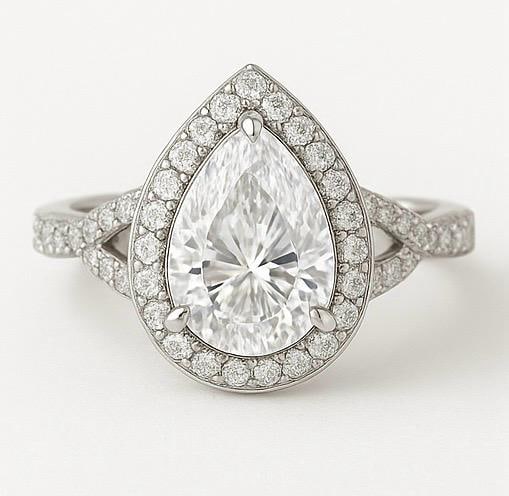 6.50 CT Lab Grown Pear Cut Diamond Halo Ring in 14K White Gold: Elegant 6.50 carat lab grown pear cut diamond centerpiece, encircled by a halo of pavé-set round diamonds with a split shank design. Crafted in 14K white gold, this ring showcases brilliance and mode