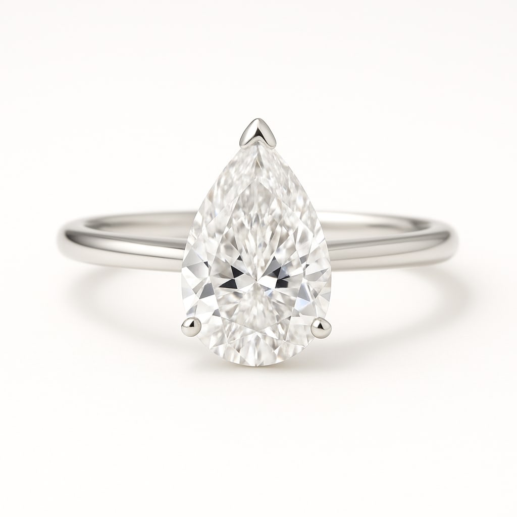 4.00 CT Lab Grown Pear Cut Diamond Solitaire Ring in 14K White Gold: Elegant 4.00 carat lab grown pear cut diamond solitaire, prong set on a polished 14K white gold band. A timeless engagement ring design that enhances the diamond’s brilliance.Color Grade: D–FClari