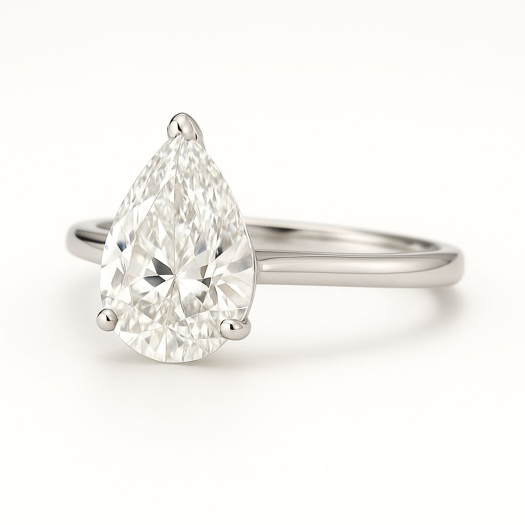 4.50 CT Lab Grown Pear Cut Diamond Solitaire Ring in 14K White Gold: Stunning 4.50 carat lab grown pear cut diamond solitaire, prong set on a polished 14K white gold band. A graceful and timeless solitaire design that highlights the brilliance of the pear shape.Color G