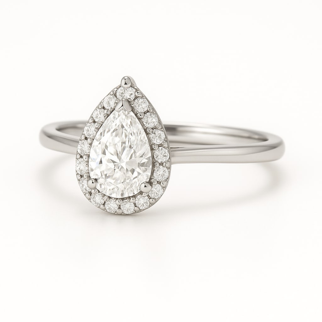 3.50 CT Lab Grown Pear Cut Diamond Halo Ring in 14K White Gold: Elegant 3.50 carat lab grown pear cut diamond, encircled by a halo of lab grown round brilliant diamonds. Set in polished 14K white gold, this ring radiates brilliance and timeless elegance.Color Grad