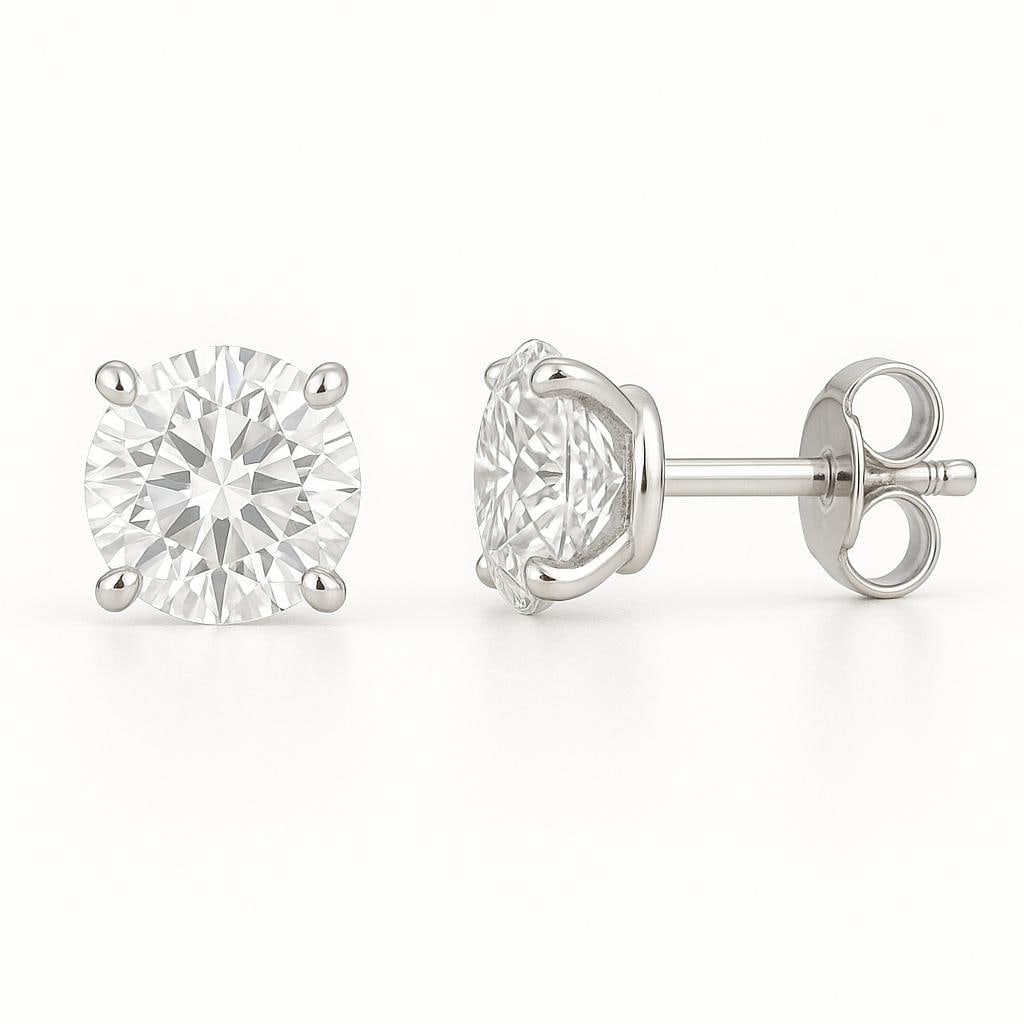 3.50 CT Lab Grown Round Brilliant Diamond Solitaire Stud Earrings in 14K White Gold: Classic pair of 3.50 carat lab grown round brilliant diamonds, set in secure four-prong 14K white gold mounts. Timeless solitaire stud earrings that deliver everyday elegance and sparkle.Color Grade: 