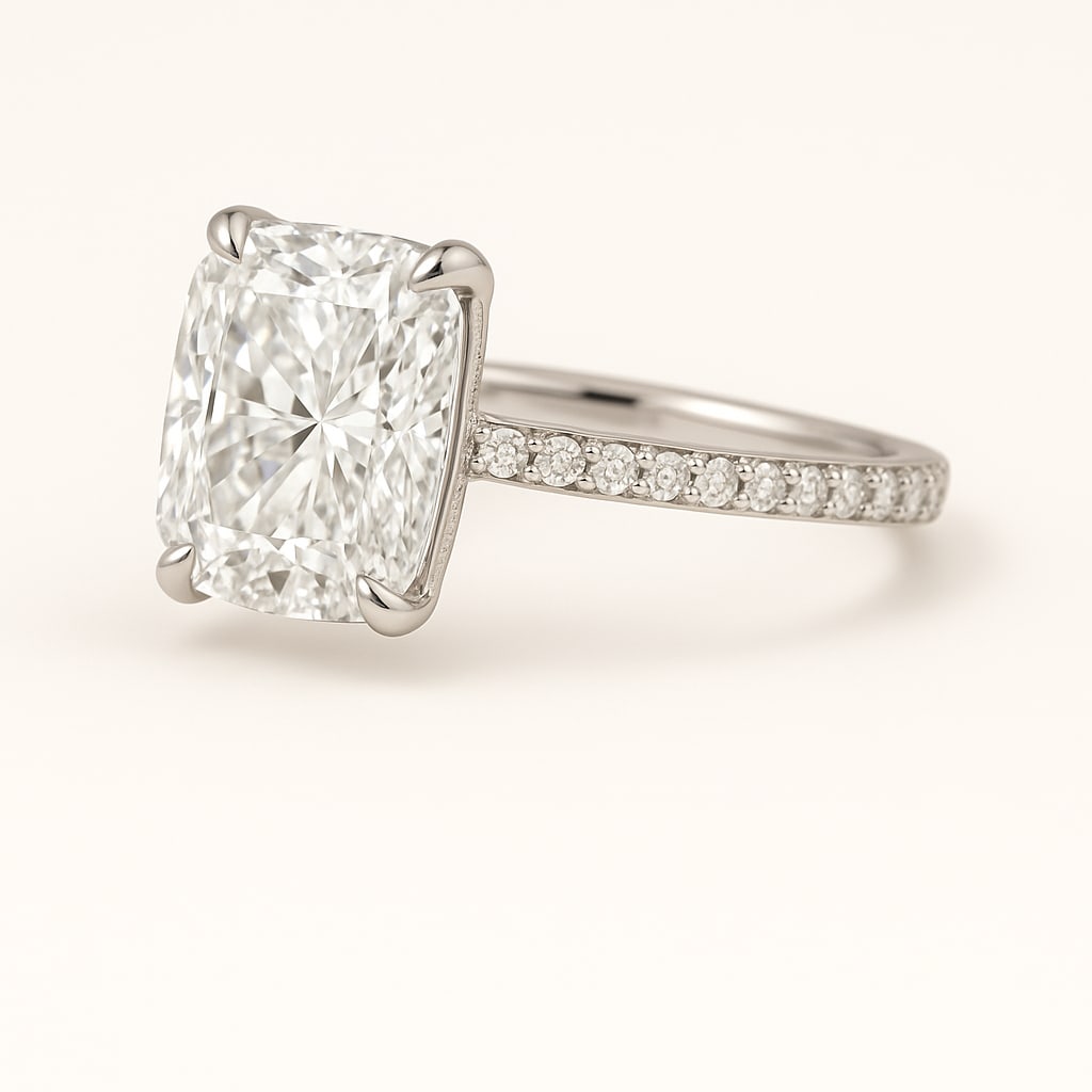 6.00 CT Lab Grown Cushion Cut Diamond Solitaire Ring with Pavé Band in 14K White Gold: Stunning 6.00 carat lab grown cushion cut diamond, prong set on a polished 14K white gold pavé band. A timeless solitaire engagement ring design that blends elegance with dazzling sparkle.Color Grade