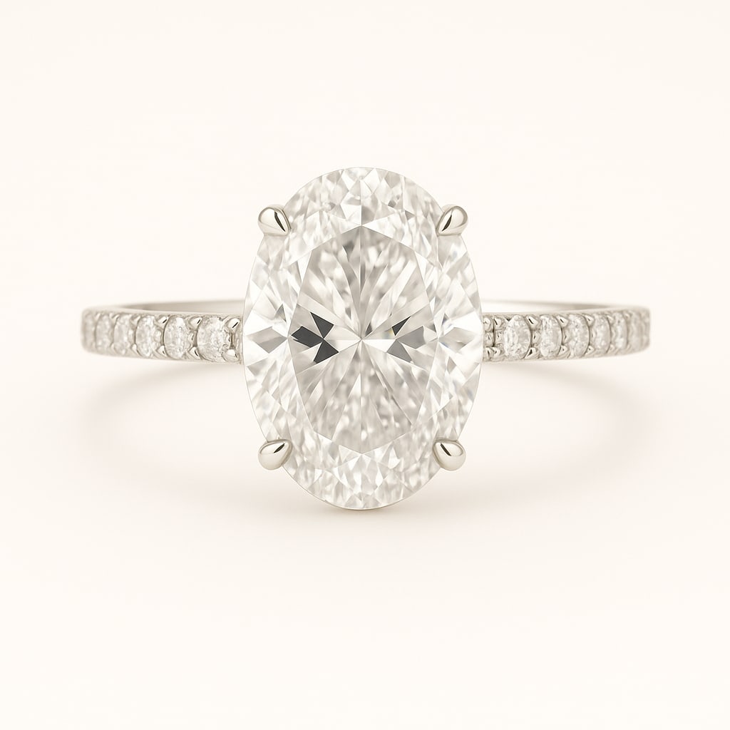 5.50 CT Lab Grown Oval Cut Diamond Solitaire Ring with Pavé Band in 14K White Gold: Exquisite 5.50 carat lab grown oval cut diamond, prong set on a polished 14K white gold pavé band. A sophisticated solitaire engagement ring that radiates brilliance and timeless elegance.Color Grade