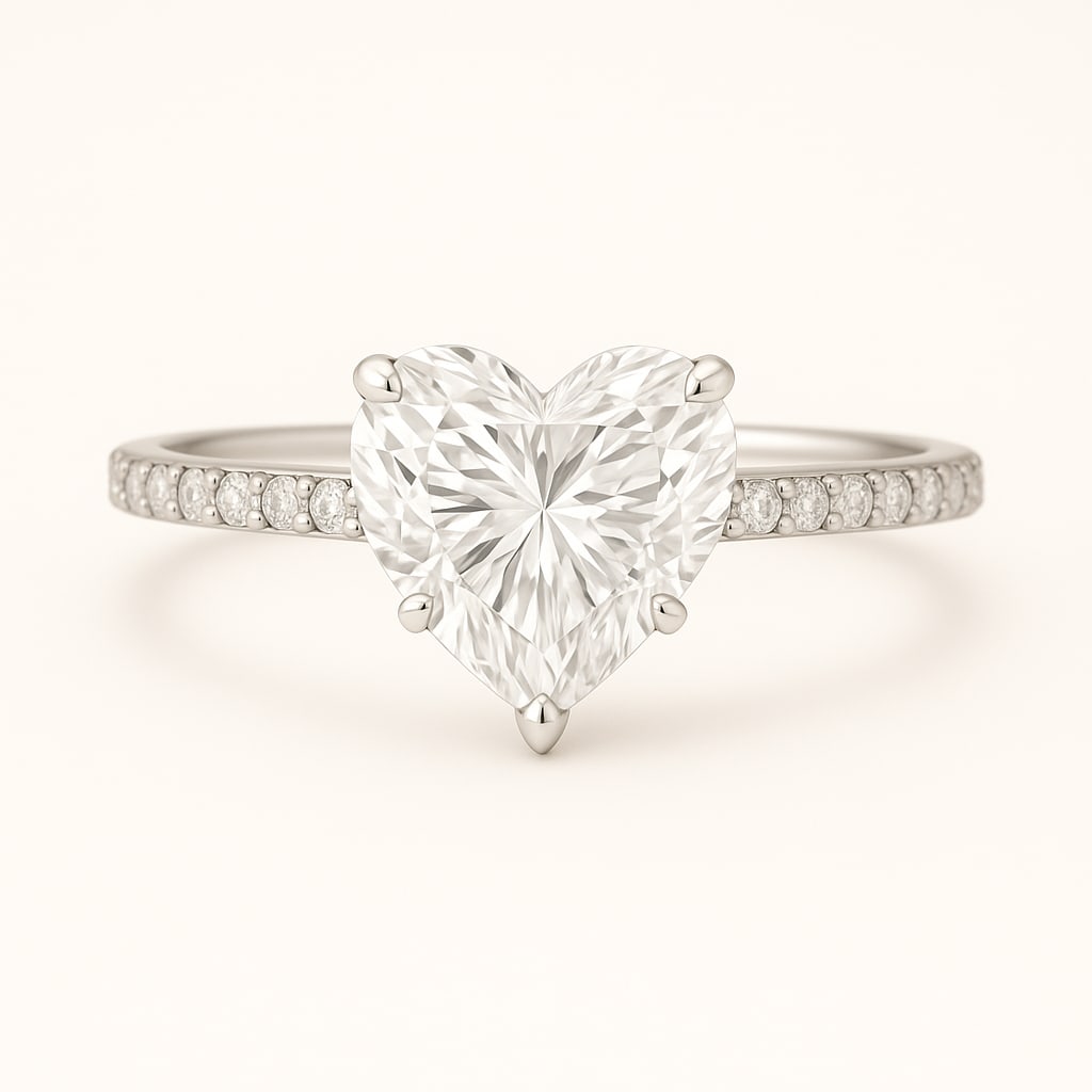 4.50 CT Lab Grown Heart Cut Diamond Solitaire Ring with Pavé Band in 14K White Gold: Romantic 4.50 carat lab grown heart cut diamond, prong set on a polished 14K white gold pavé band. A solitaire engagement ring that symbolizes love while adding brilliance with pavé-set accents.Colo