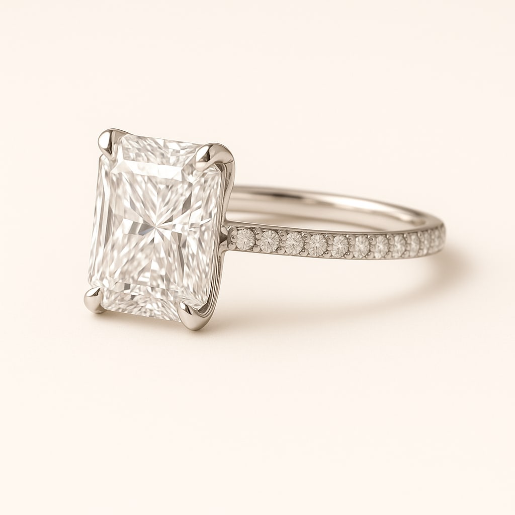 5.00 CT Lab Grown Radiant Cut Diamond Solitaire Ring with Pavé Band in 14K White Gold: Stunning 5.00 carat lab grown radiant cut diamond, prong set on a polished 14K white gold pavé band. A modern solitaire engagement ring design that radiates brilliance and sophistication.Color Grade: