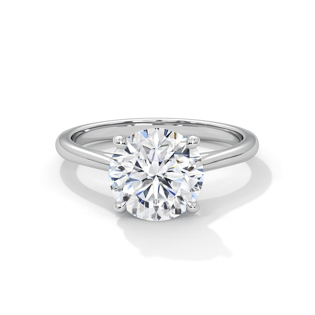 2.50 CT Lab Grown Round Brilliant Diamond Solitaire Ring in 14K White Gold: Timeless 2.50 carat lab grown round brilliant diamond, prong set on a polished 14K white gold band. A simple yet elegant solitaire engagement ring that never goes out of style.Color Grade: D–FClarit