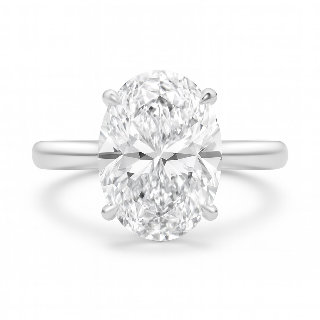 7.50 CT Oval Cut Lab Grown Diamond Solitaire Ring in 14K White Gold: An extraordinary 7.50 carat oval cut lab grown diamond takes center stage in this elegant solitaire design. Set in a sleek 14K white gold band, the diamond’s elongated shape creates a flattering, ti