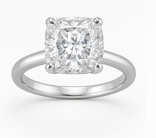 4.50 CT Cushion Cut Lab Grown Diamond Solitaire Ring in 14K White Gold: A stunning 4.50 carat cushion cut lab grown diamond sparkles brilliantly in a classic solitaire setting. Mounted on a polished 14K white gold band, this ring highlights the diamond’s brilliance and 