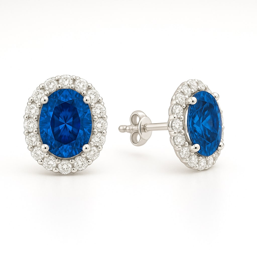 6.00 Ct Oval Cut London Blue Topaz & Diamond Halo Stud Earrings in 14K White Gold: A stunning pair of luxury stud earrings featuring approximately 6.00 carats total weight of vivid oval cut London Blue Topaz gemstones surrounded by sparkling natural diamond halos in polished 14K whi