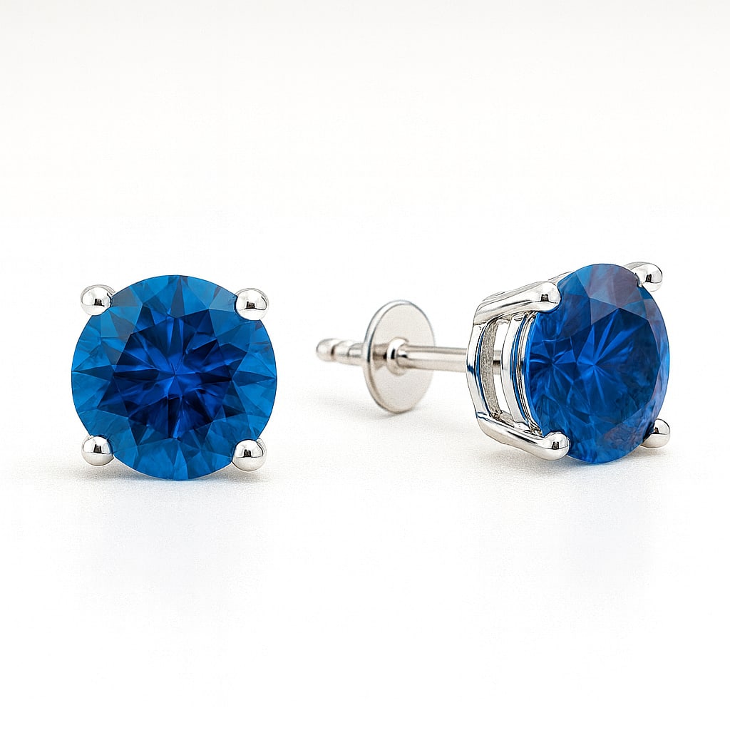 5.00 Ct Round Cut Blue Sapphire Stud Earrings in 14K White Gold: A timeless pair of elegant stud earrings featuring approximately 5.00 carats total weight of vibrant round cut blue sapphires set in classic 14K white gold solitaire mountings. The rich royal blue col