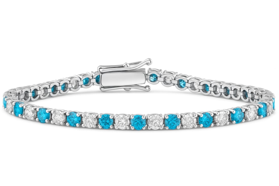 6.00 Ct Blue & White Lab Grown Diamond Tennis Bracelet in 14K White Gold – 6 Inch: A striking luxury tennis bracelet featuring approximately 6.00 carats total weight of alternating blue and white lab grown diamonds set in polished 14K white gold. The vivid blue diamonds create a bol