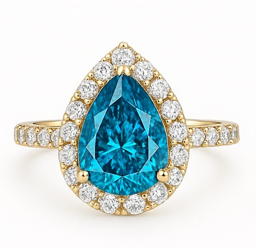 3.00 Ct Pear Cut Blue Lab Grown Diamond Halo Ring in 14K Yellow Gold: A striking and luxurious halo ring featuring an approximately 3.00 carat pear cut blue lab grown diamond set in fine 14K yellow gold. The vivid blue center stone displays exceptional brilliance and ca