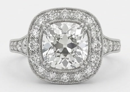 Lab Grown 4.00 Ct Cushion (Old Mine Look) Diamond Ring – Vintage Halo with Tapered Shank – / in: Sophisticated and modern, this ring is defined by a 4.00 carat lab grown Cushion (Old Mine Look) center diamond as the focal point. The vintage halo with tapered shank design is paired with White Gold