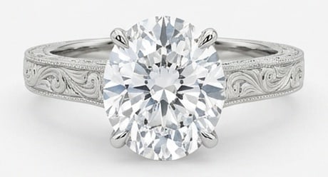 Lab Grown 10.00 Ct Oval Diamond Ring – Solitaire with Hand-Engraved Scroll Shank – / in 14K: A timeless statement, this ring highlights a 10.00 carat lab grown Oval center diamond. Featuring Solitaire with Hand-Engraved Scroll Shank elements that bring depth and dimension to the setting. Feat