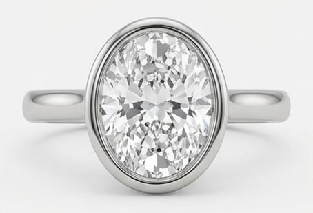Lab Grown 4.00 Ct Oval Diamond Ring – Modern Sleek Bezel Set Solitaire – / in 14K White Gold: Distinctive in silhouette, this ring centers on a 4.00 carat lab grown Oval center diamond. Featuring the Modern Sleek Bezel Set Solitaire design language, giving the piece a memorable, structured fee