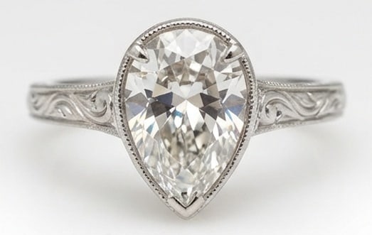 Lab Grown 3.00 Ct Pear Shape Diamond Ring – Vintage Bezel/Prong Hybrid with Scroll Engraving – /: Designed to stand out, this ring presents a 3.00 carat lab grown Pear Shape center diamond. Set in White Gold , the ring is styled with vintage bezel prong hybrid with scroll engraving details that de