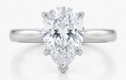 Lab Grown 5.00 Ct Pear Shape Diamond Ring – Classic Pear Solitaire (3-Prong) – / in 14K White: Striking and elegant, this ring features a 5.00 carat lab grown Pear Shape center diamond. Featuring the Classic Pear Solitaire (3-Prong) styling that frames the centerpiece and shapes the overall pro