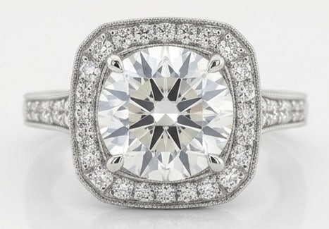 Lab Grown 5.00 Ct Round Brilliant Diamond Ring – Round Center in Cushion Halo (Split Shank) – /: Beautifully styled, this ring is anchored by a 5.00 carat lab grown Round Brilliant center diamond as the focal point. The round center in cushion halo (split shank) design is paired with White Gold f