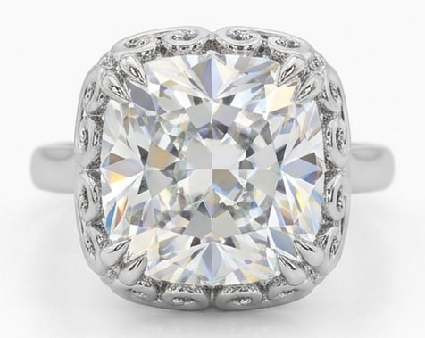Lab Grown 6.00 Ct Cushion (Modified Brilliant) Diamond Ring – Vintage Cushion Solitaire with: Designed to stand out, this ring presents a 6.00 carat lab grown Cushion (Modified Brilliant) center diamond. White Gold gives the piece a refined, neutral foundation for daily wear or events. The ove