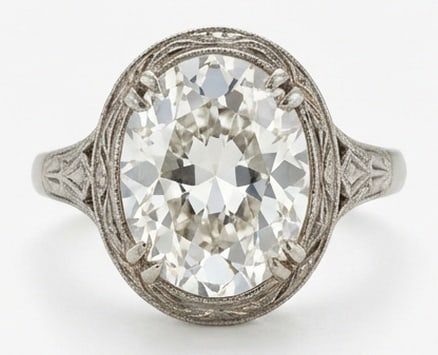 Lab Grown 4.00 Ct Oval Diamond Ring – Vintage Oval Bezel with Engraved Vine Details – / in 14K: Graceful and eye-catching, this ring is set with a 4.00 carat lab grown Oval center diamond. Set in White Gold , the ring is styled with vintage oval bezel with engraved vine details details that defi