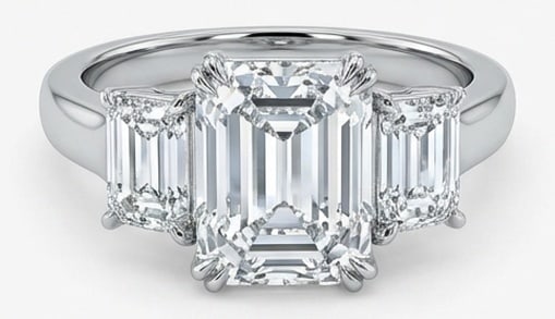 Lab Grown 4.00 Ct Emerald Cut Diamond Ring – Classic Three-Stone Emerald Cut (Stepped) – / in: Chic and distinctive, this ring showcases a 4.00 carat lab grown Emerald Cut center diamond. Set in White Gold , the ring is styled with classic three-stone emerald cut (stepped) details that define i