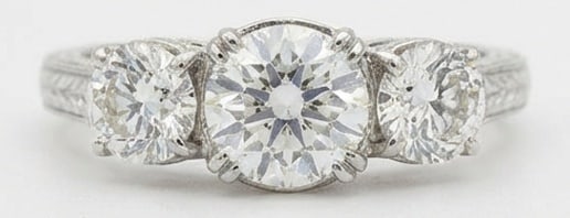 Lab Grown 3.00 Ct Round Brilliant Diamond Ring – Vintage Three-Stone Round with Engraved Shank –: Bold yet refined, this design showcases a 3.00 carat lab grown Round Brilliant center diamond. White Gold gives the piece a refined, neutral foundation for daily wear or events. The overall style foll