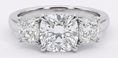 Lab Grown 4.00 Ct Cushion Diamond Ring – Classic three-stone prong setting with polished band –: Distinctive in silhouette, this ring centers on a 4.00 carat lab grown Cushion center diamond. Featuring the Classic three-stone prong setting with polished band design language, giving the piece a me