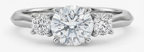 Lab Grown 3.00 Ct Round Diamond Ring – Classic three-stone prong setting with tapered knife-edge: Classic with a contemporary edge, this ring spotlights a 3.00 carat lab grown Round center diamond. White Gold gives the piece a refined, neutral foundation for daily wear or events. The overall style