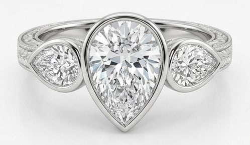 Lab Grown 3.00 Ct Pear Diamond Ring – Bezel-set three-stone with engraved shank and milgrain edges: Beautifully styled, this ring is anchored by a 3.00 carat lab grown Pear center diamond. Featuring a Bezel-set three-stone with engraved shank and milgrain edges aesthetic, balancing bold geometry wit