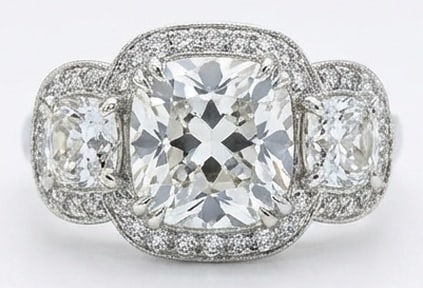 Lab Grown 6.00 Ct Cushion Diamond Ring – Triple halo setting (center and sides) with pave band and: Sophisticated and modern, this ring is defined by a 6.00 carat lab grown Cushion center diamond. Featuring the Triple halo setting (center and sides) with pave band and milgrain theme, offering a dist