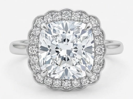 Lab Grown 6.00 Ct Cushion Diamond Ring – Solitaire with scalloped floral diamond halo and plain: Distinctive in silhouette, this ring centers on a 6.00 carat lab grown Cushion center diamond. Featuring the Solitaire with scalloped floral diamond halo and plain band design language, giving the pie