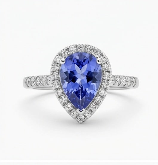 3.0 Ct Pear Natural Tanzanite 14K White Gold Halo Setting with Pave Shank Ring - Certified: This certified fine jewelry piece features a 3.0 carat natural Tanzanite in a Pear cut, crafted in 14K White Gold. The Halo Setting with Pave Shank design highlights the beauty of the natural center s