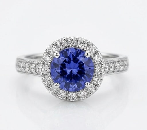 2.0 Ct Round Natural Tanzanite 14K White Gold Halo Setting with Pave Shank Ring - Certified: This certified fine jewelry piece features a 2.0 carat natural Tanzanite in a Round cut, crafted in 14K White Gold. The Halo Setting with Pave Shank design highlights the beauty of the natural center 