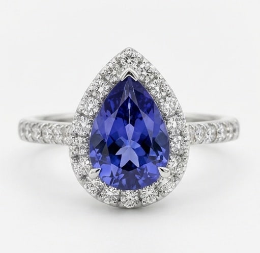 2.5 Ct Pear Natural Tanzanite 14K White Gold Halo Setting with Pave Shank Ring - Certified: This certified fine jewelry piece features a 2.5 carat natural Tanzanite in a Pear cut, crafted in 14K White Gold. The Halo Setting with Pave Shank design highlights the beauty of the natural center s