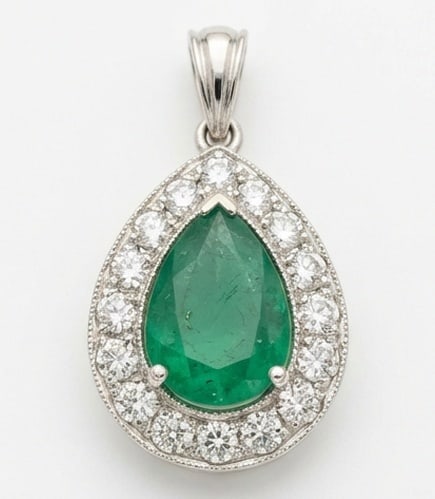 2.0 Ct Pear Natural Emerald 14K White Gold Halo Pendant - Certified: This certified fine jewelry piece features a 2.0 carat natural Emerald in a Pear cut, crafted in 14K White Gold. The Halo Pendant design highlights the beauty of the natural center stone. It is accent