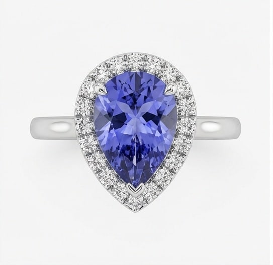 2.0 Ct Pear Natural Tanzanite 14K White Gold Halo Setting with Pave Shank Ring - Certified: This certified fine jewelry piece features a 2.0 carat natural Tanzanite in a Pear cut, crafted in 14K White Gold. The Halo Setting with Pave Shank design highlights the beauty of the natural center s