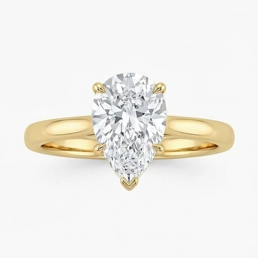 IGI Certified 1.45 ct Pear Cut Natural Diamond Raised Basket Solitaire Ring in 14K Yellow Gold: A remarkable 1.45 carat natural pear-cut diamond ring, expertly crafted in 14K Yellow Gold and created to showcase timeless sophistication. This design highlights the beauty of the center stone alone,
