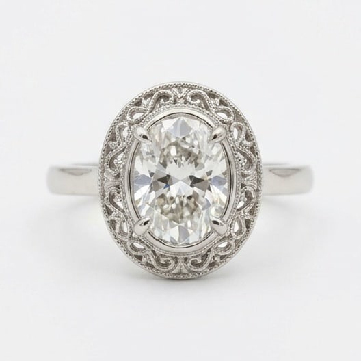 IGI Certified 1.55 ct Oval Cut Natural Diamond Antique Border Ring in 14K White Gold: An elegant 1.55 carat natural oval-cut diamond ring, finely made in 14K White Gold with a refined profile and auction-worthy presentation. This design highlights the beauty of the center stone alone, 
