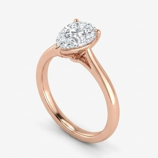 GIA Certified 1.6 ct Pear Cut Natural Diamond Open Gallery Solitaire Ring in 14K Rose Gold: An exceptional 1.6 carat natural pear-cut diamond ring, masterfully crafted in luxurious 14K Rose Gold and designed to embody refined elegance and lasting beauty. This design highlights the beauty of 