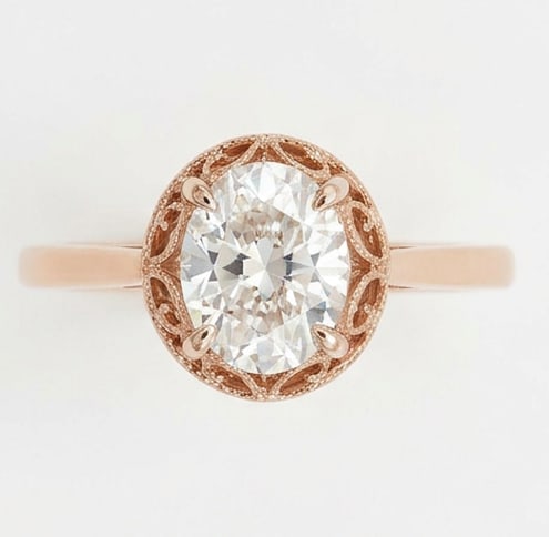 GIA Certified 1.3 ct Oval Cut Natural Diamond Vintage Gallery Ring in 14K Rose Gold: This distinguished 1.3 carat natural oval-cut diamond ring is beautifully crafted in 14K Rose Gold, offering exceptional brilliance and enduring appeal. This design highlights the beauty of the center