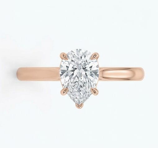 IGI Certified 1.6 ct Pear Cut Natural Diamond Cathedral Solitaire Ring in 14K Rose Gold: This distinguished 1.6 carat natural pear-cut diamond ring is beautifully crafted in 14K Rose Gold, offering exceptional brilliance and enduring appeal. This design highlights the beauty of the center