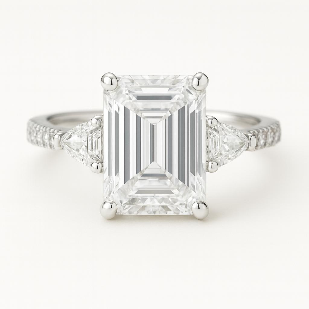 6.50 CT Lab Grown Emerald Cut Diamond Ring with Trillion Side Stones & Pavé Band in 14K White Gold: Stunning 6.50 carat lab grown emerald cut diamond centerpiece, flanked by lab grown trillion cut side stones. The pavé-set diamond band in 14K white gold enhances sparkle and elegance, creating a lux