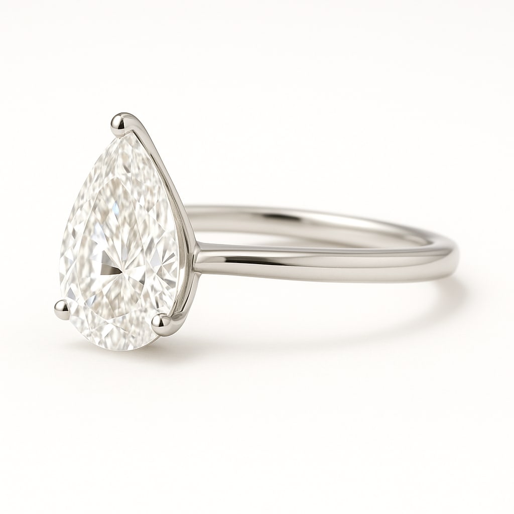 4.50 CT Lab Grown Pear Cut Diamond Solitaire Ring in 14K White Gold: Stunning 4.50 carat lab grown pear cut diamond solitaire, prong set on a polished 14K white gold band. A graceful and timeless solitaire design that highlights the brilliance of the pear shape.Color G