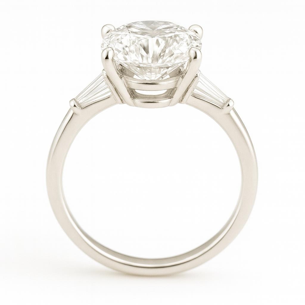6.50 CT Lab Grown Oval Cut Diamond Three-Stone Ring in 14K White Gold: Magnificent 6.50 carat lab grown oval cut diamond, accented with two tapered baguette side stones. Set in polished 14K white gold, this three-stone engagement ring symbolizes past, present, and future