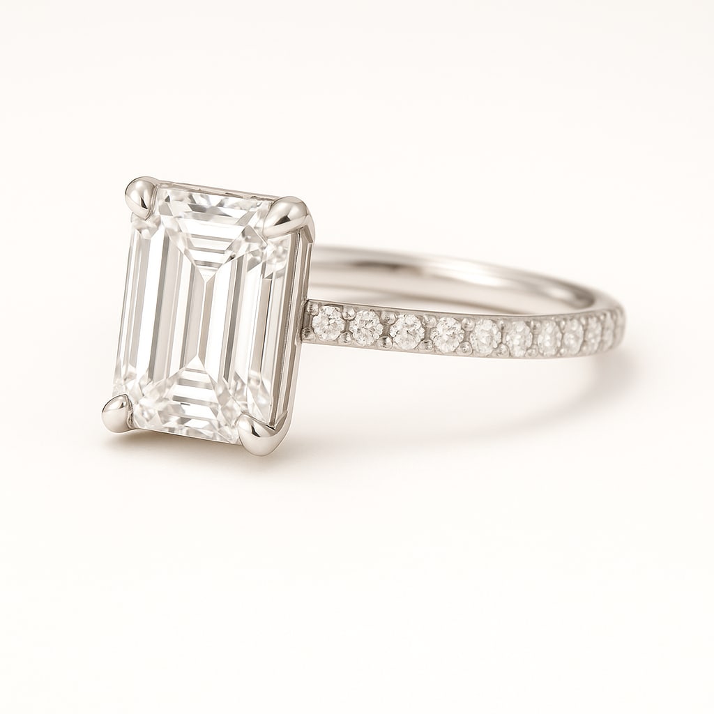 5.00 CT Lab Grown Emerald Cut Diamond Solitaire Ring with Pavé Band in 14K White Gold: Exquisite 5.00 carat lab grown emerald cut diamond, prong set on a polished 14K white gold band accented with pavé-set diamonds. A sophisticated engagement ring that highlights the clarity and brilli