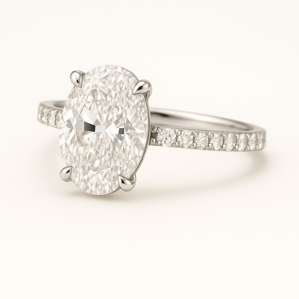 5.50 CT Lab Grown Oval Cut Diamond Solitaire Ring with Pavé Band in 14K White Gold: Exquisite 5.50 carat lab grown oval cut diamond, prong set on a polished 14K white gold pavé band. A sophisticated solitaire engagement ring that radiates brilliance and timeless elegance.Color Grade
