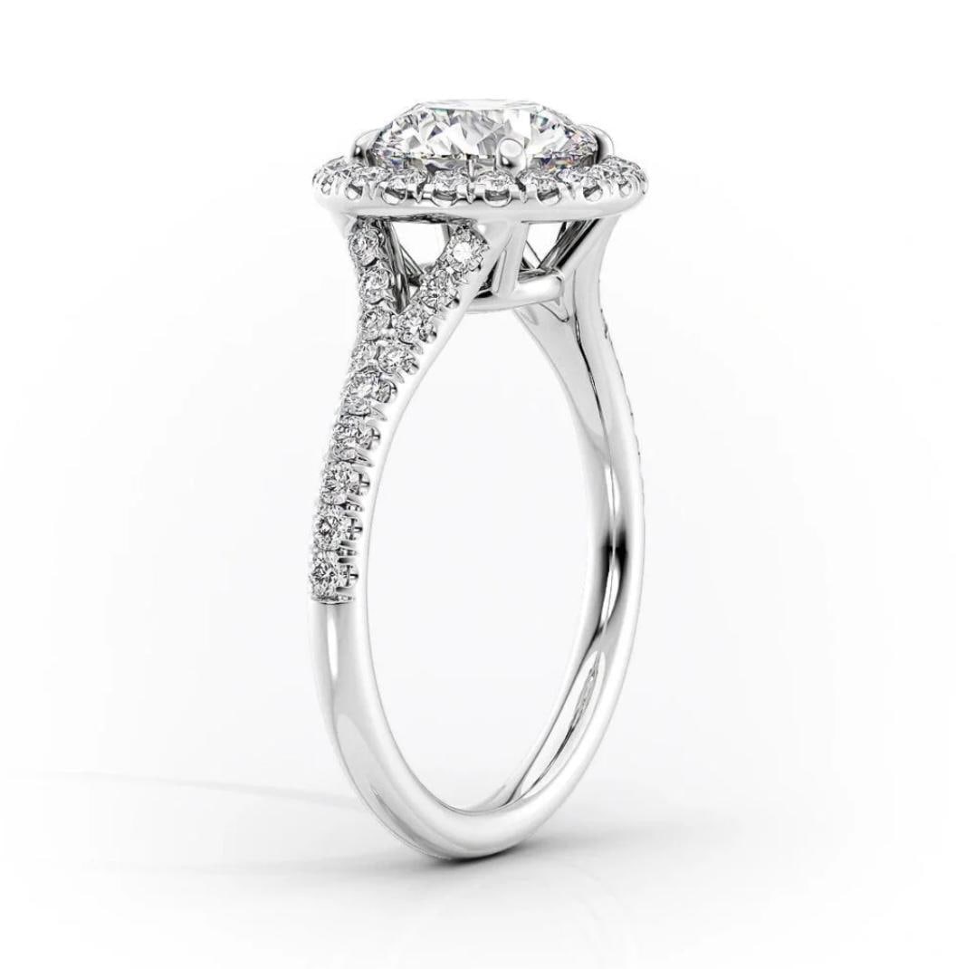 3.00 CT Round-Cut lab-grown diamond Diamond Halo Ring in 14K White Gold: A timeless 3.00 carat lab-grown diamond round-cut diamond halo ring crafted in solid 14K white gold. The pav?-set halo enhances brilliance and sparkle, making it ideal for engagement or luxury gifting